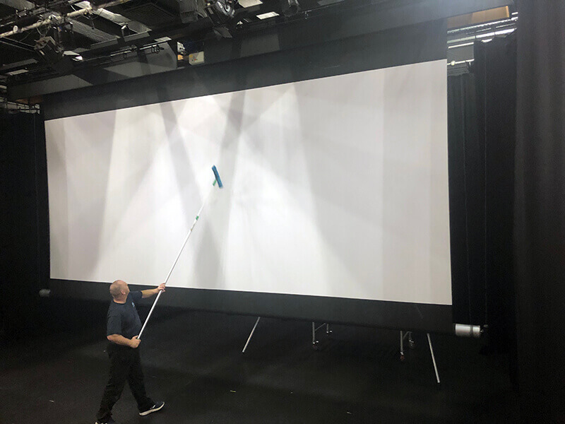 Projection screen cleaning